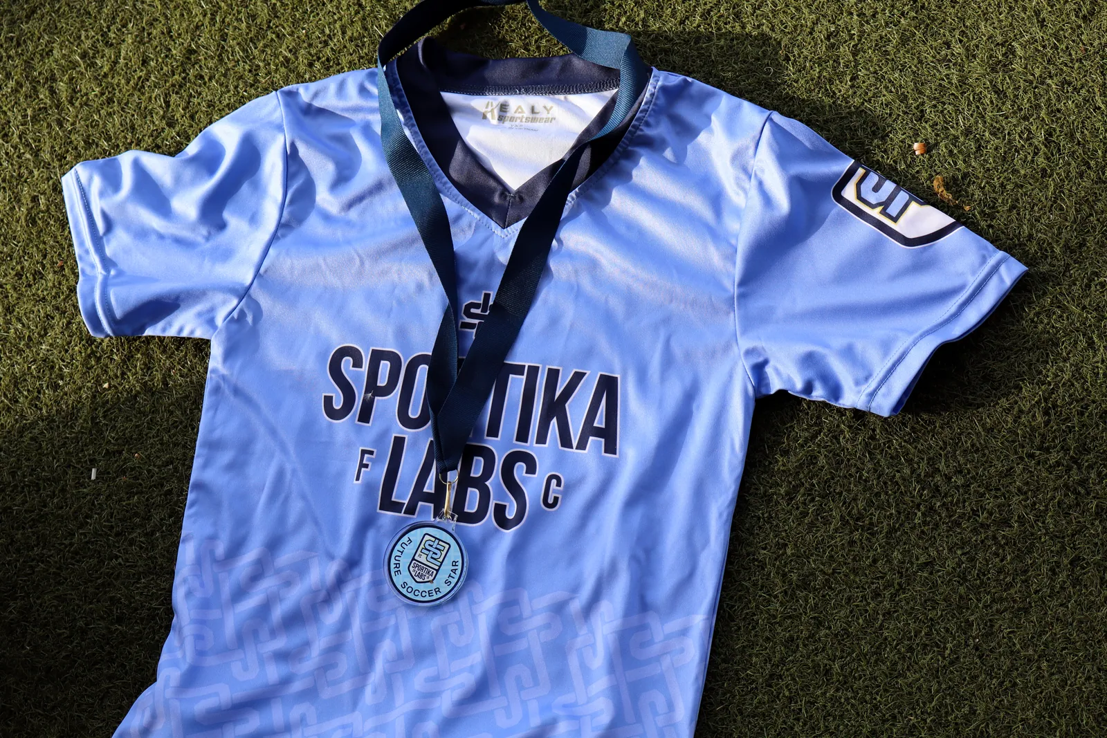 Close-up of Sportika Labs jersey with medal